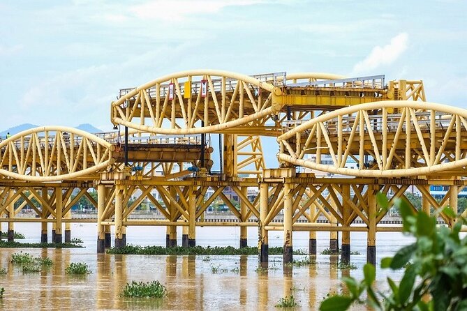 Da Nang Night Foodie Tour City and Han River Cruise By Private - Helio Center and the night market energy near the Sunwheel