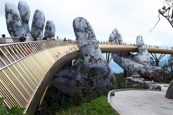 DaNang Fullday Tour-GOLDEN BRIDGE-MARBLE MOUNTAIN-MONKEY MOUNTAIN - Golden Bridge: The hands, the wood floor, and photo-ready timing
